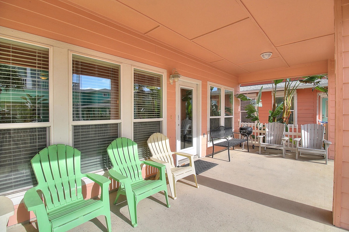 Relax in your private covered patio with colorful Adirondack chairs and BBQ grill, perfect for morning coffee or evening meals.