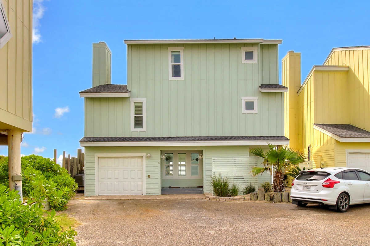 Charming coastal property with modern design and convenient garage parking in a quiet residential neighborhood.