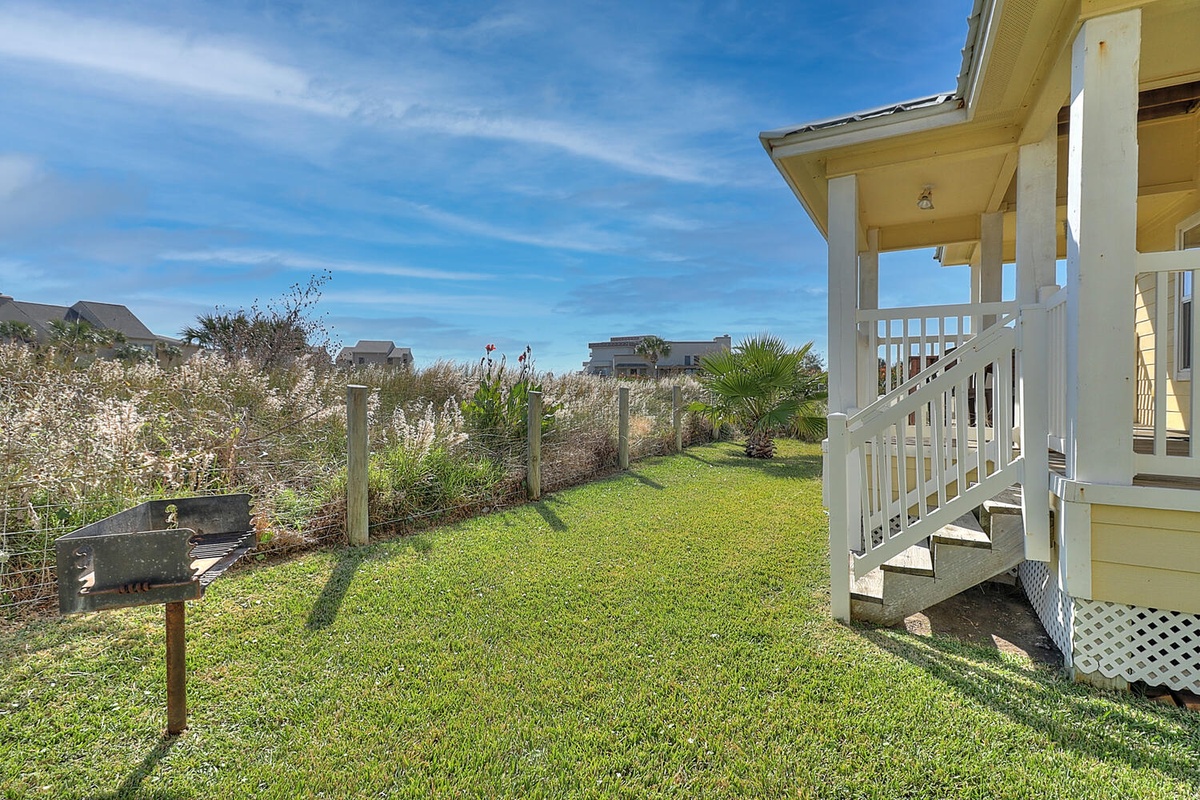 Your own private lawn with BBQ grill creates the perfect space for outdoor dining and relaxation.