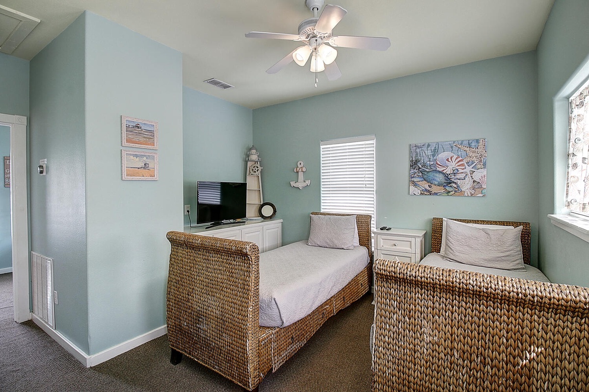Drift off in your coastal twin bedroom, where wicker beds and sea-inspired artwork create a peaceful retreat for restful nights.