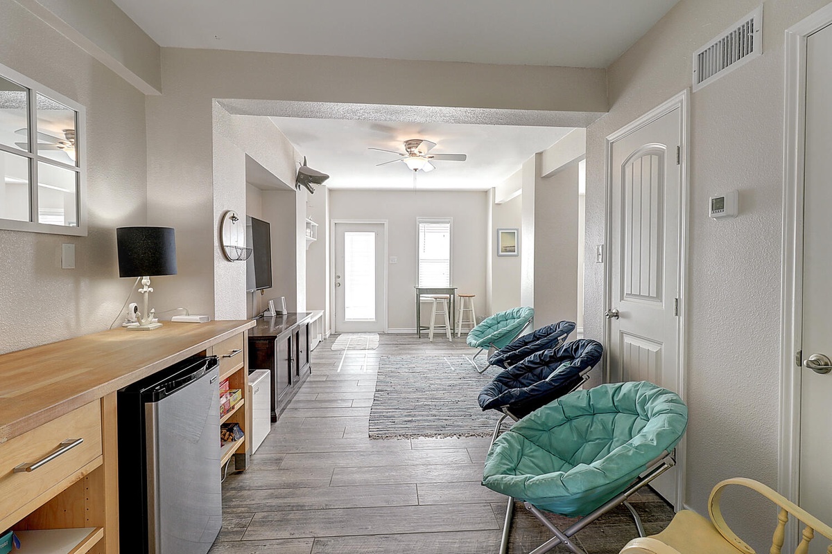 Your bright, open living space features colorful seating and modern amenities, perfect for relaxing after exploring.