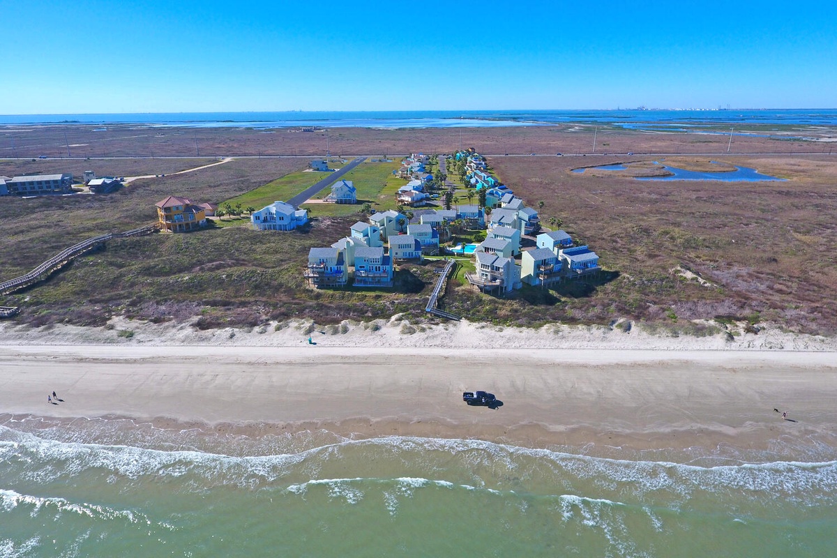 Exclusive beachfront community nestled between pristine coastline and coastal marshlands, offering direct beach access and stunning ocean views.