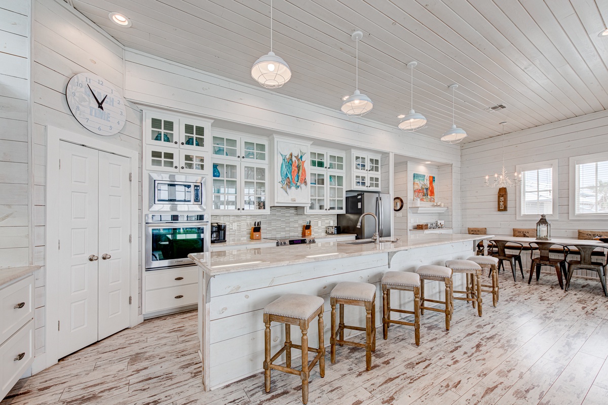 Your spacious coastal kitchen awaits with gleaming countertops, modern appliances, and a breakfast bar where you'll savor morning coffee.