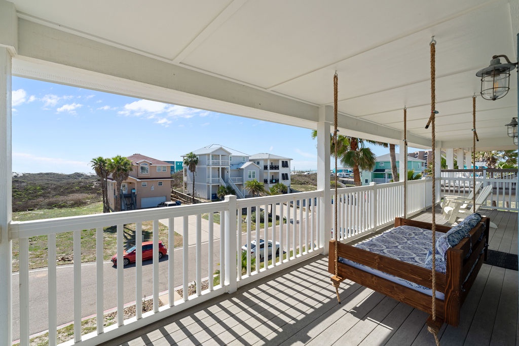 Drift into pure relaxation on this dreamy porch swing, where tropical breezes and stunning coastal views create your perfect retreat.