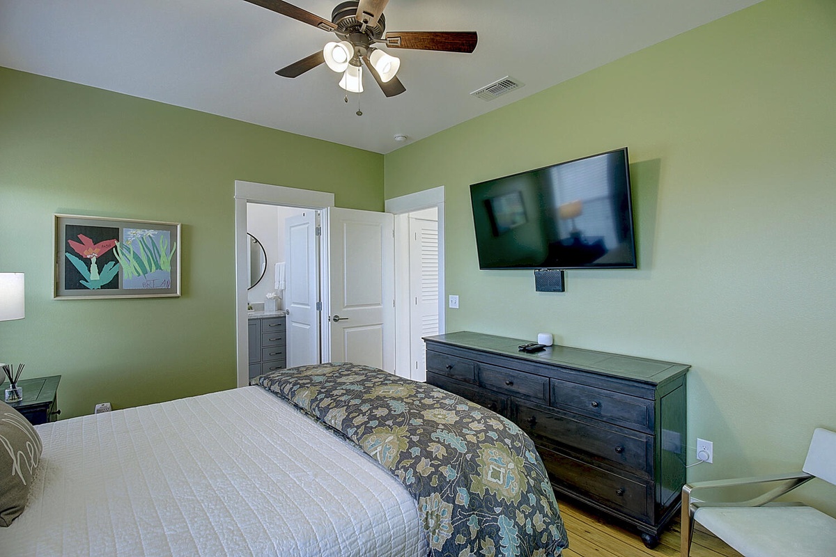 Unwind in your peaceful green retreat with comfortable bedding, ceiling fan, flat-screen TV, and ample storage for all your belongings.