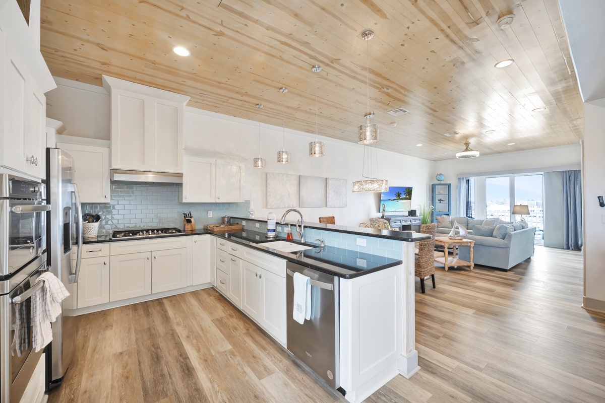 Your spacious kitchen flows seamlessly into the living area, featuring gleaming countertops and ocean views that make every meal feel like a coastal escape.