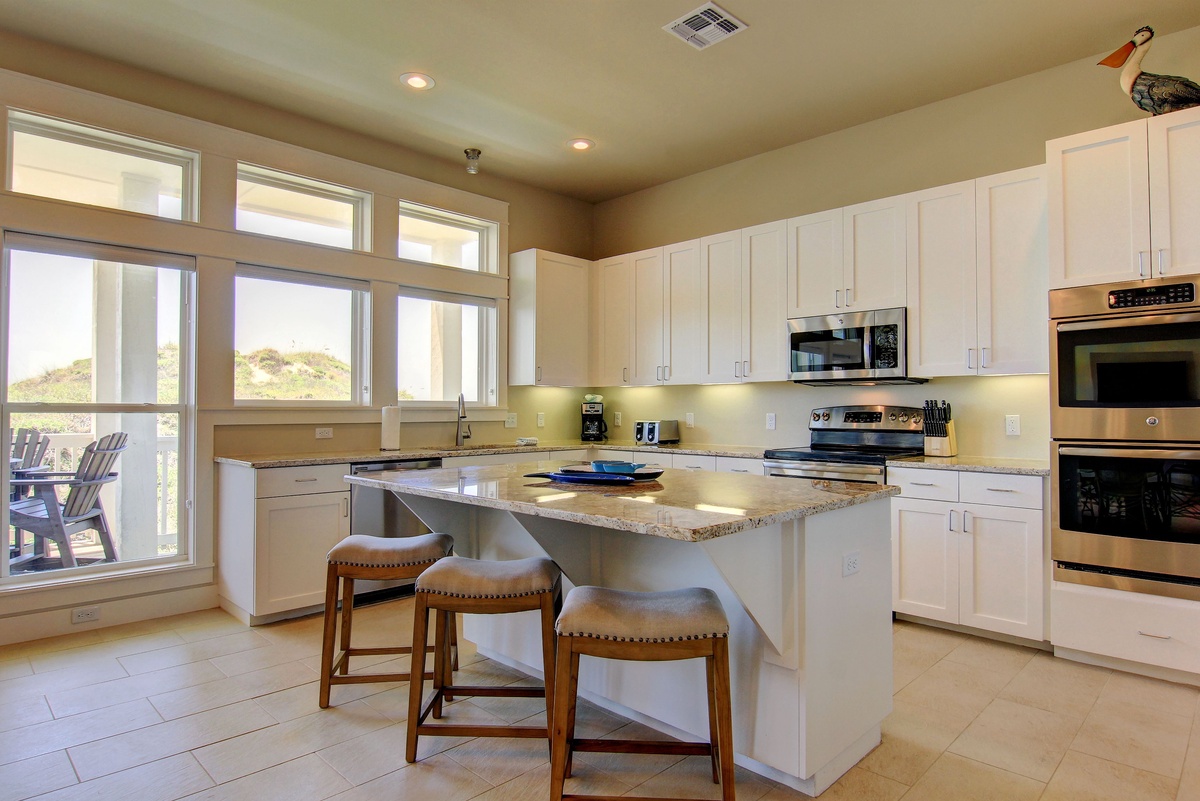 Cook memorable meals in your bright, fully-equipped kitchen featuring granite counters, stainless appliances, and a convenient breakfast island.