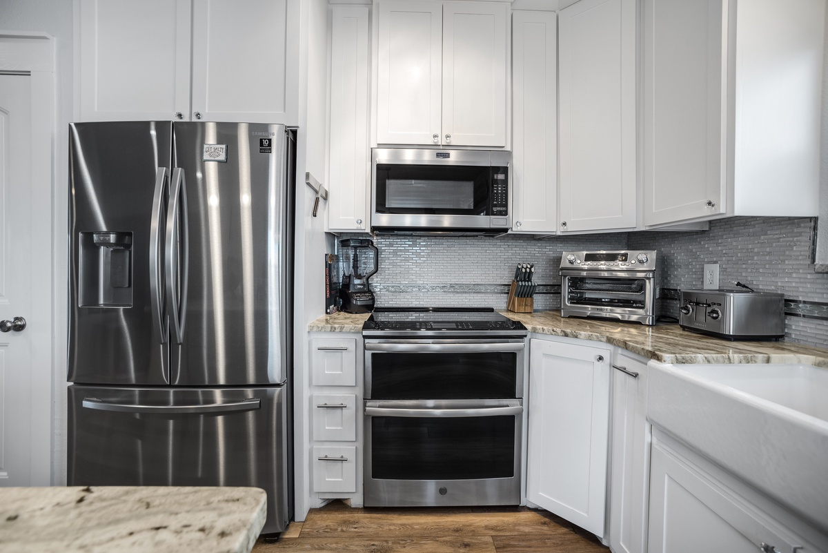 Your modern kitchen features stainless steel appliances and granite countertops, perfect for preparing meals during your stay.