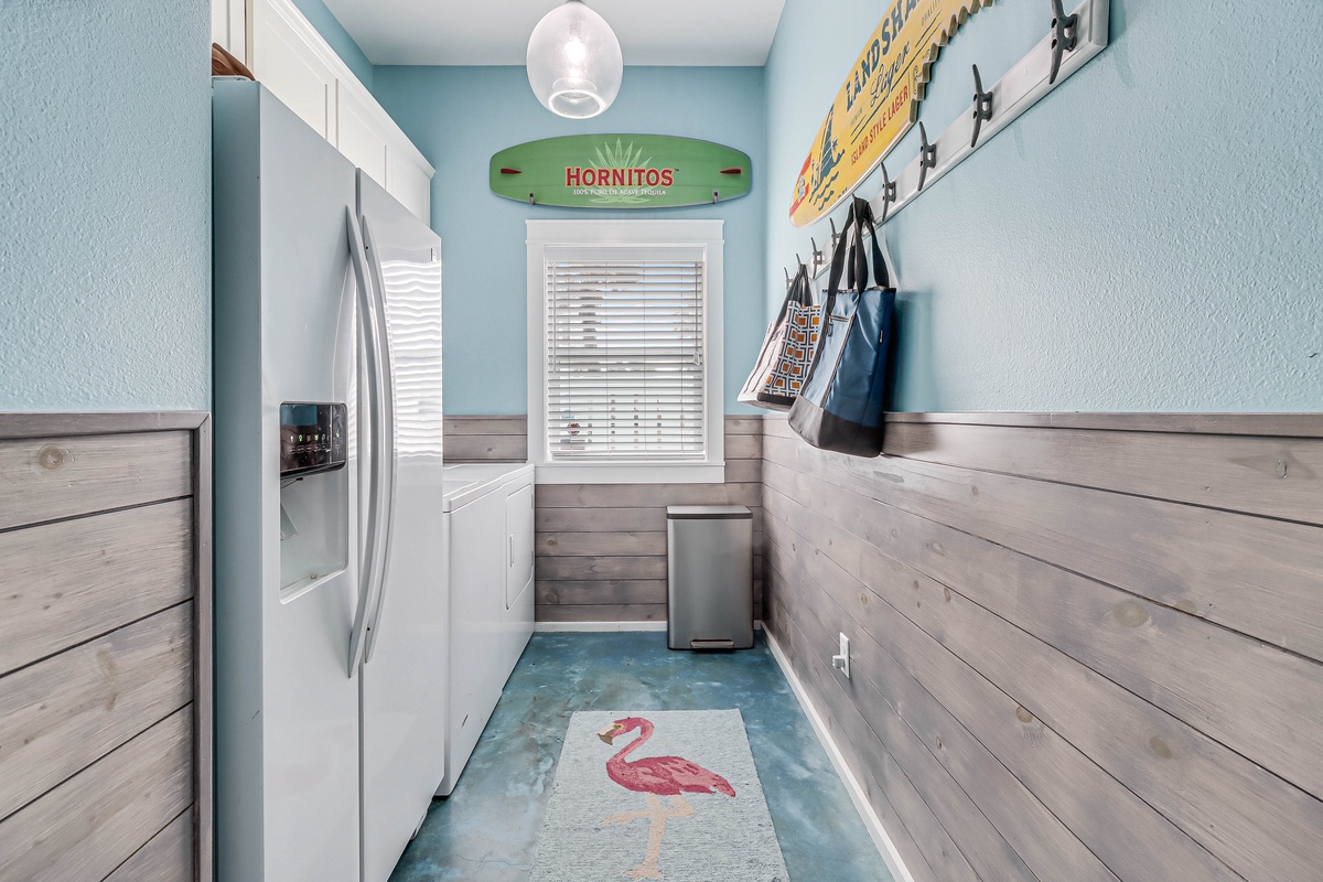 Your cheerful laundry space makes chores feel like a breeze with coastal charm and playful touches.