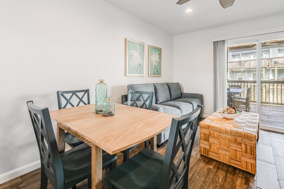Gather around your stylish dining table for memorable meals, then unwind on the cozy sofa while natural light floods this beautifully designed space.