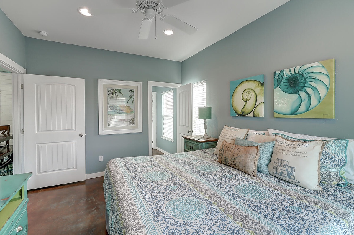 Rest peacefully in your coastal-themed bedroom where soothing sea-glass walls and ocean-inspired artwork create the perfect seaside sanctuary.