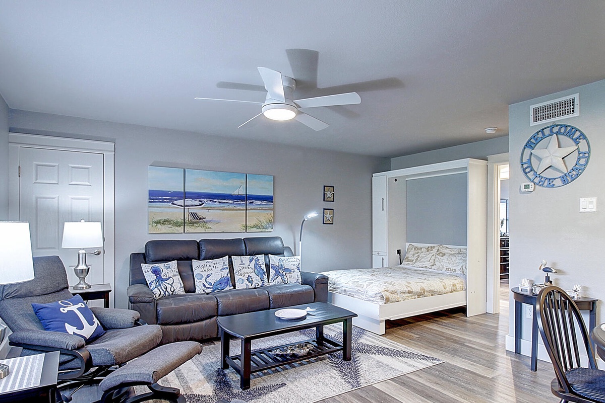 Your stylish studio features a clever Murphy bed that transforms your space from cozy living room to comfortable bedroom in seconds.