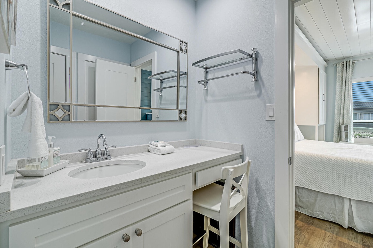 Freshen up in your private ensuite with classic white fixtures, granite countertops, and plush towels waiting for you.