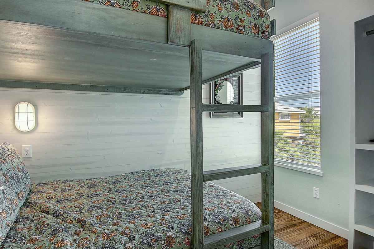 Your kids will love these custom bunk beds with their charming butterfly bedding and built-in ladder, perfect for sweet dreams.