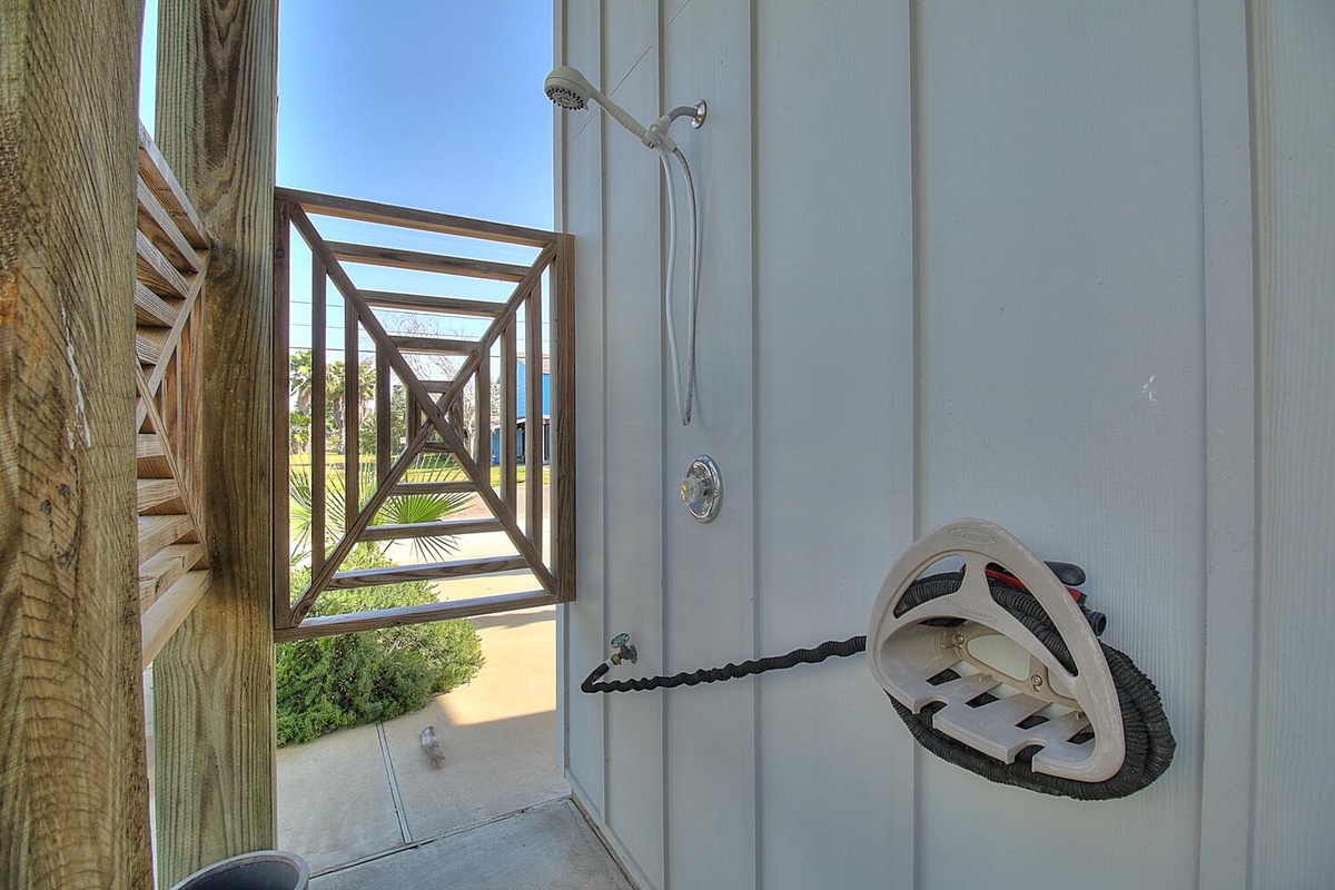 Step into your refreshing outdoor shower space, where warm water meets cool breezes and tropical views create the perfect bathing retreat.