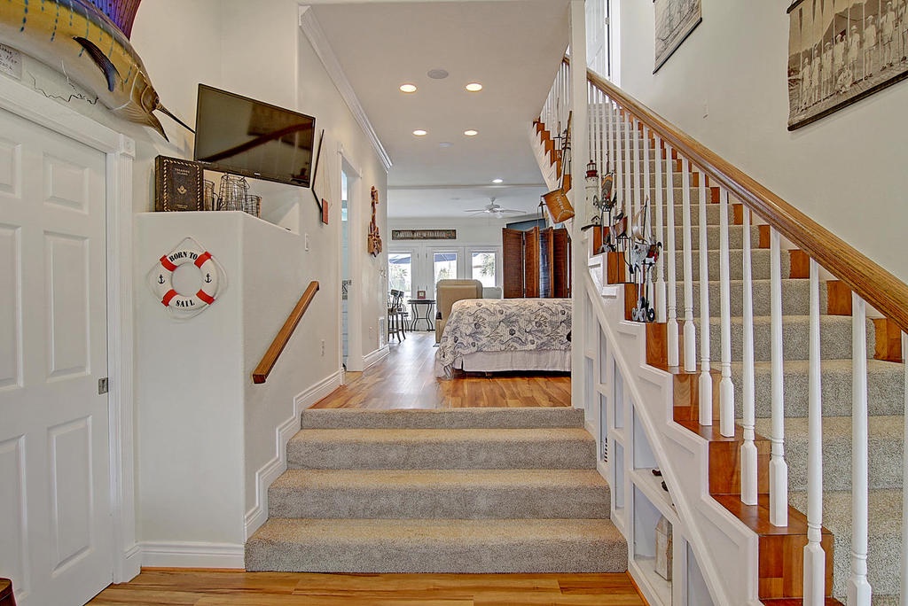 Step into this welcoming home where nautical charm meets comfort. Gleaming hardwood floors and coastal décor create your perfect retreat.