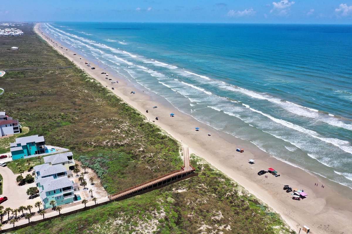 Stunning beachfront destination with miles of pristine coastline and azure waters stretching to the horizon.