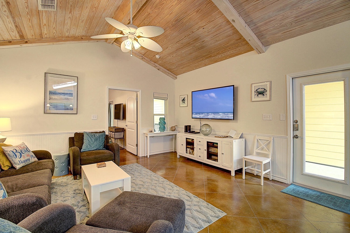 Sink into plush seating under beautiful wood beam ceilings as you unwind with ocean views on the large flat-screen TV.