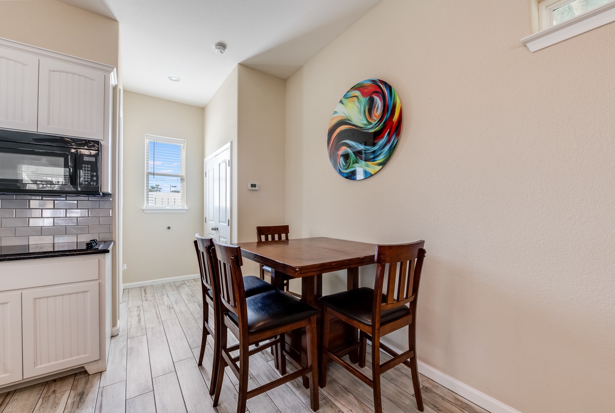 Gather around your private dining table for meals and conversation, with a bright kitchen at your fingertips.
