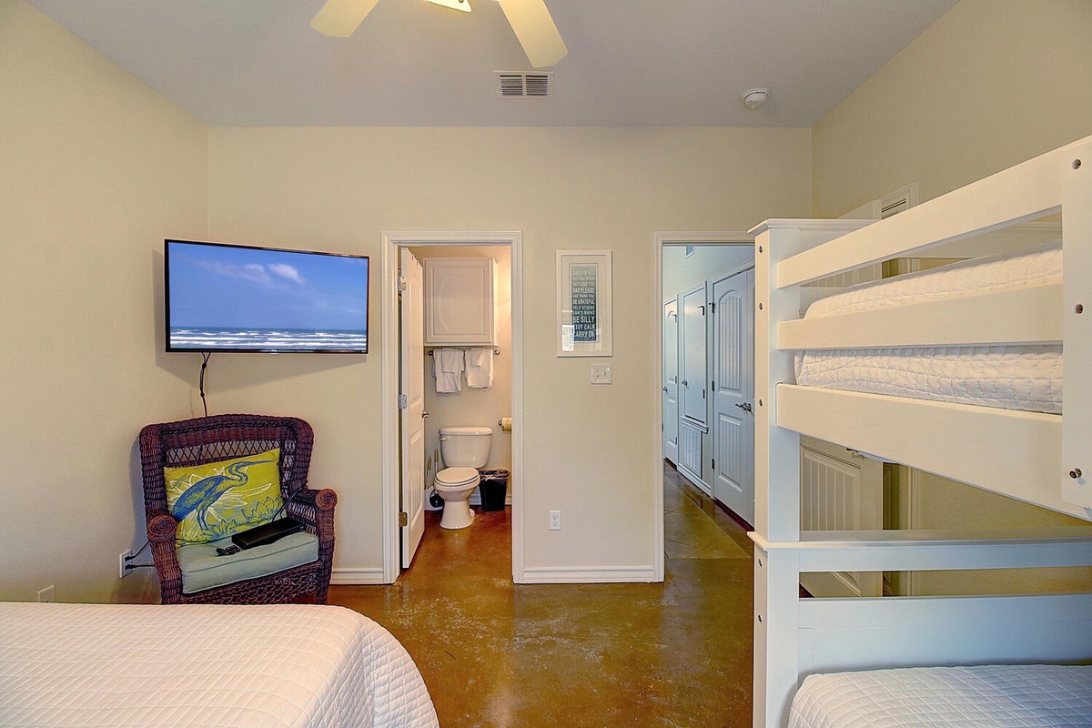 Your cozy room features comfortable beds, entertainment, and your own private bathroom for the perfect coastal getaway.