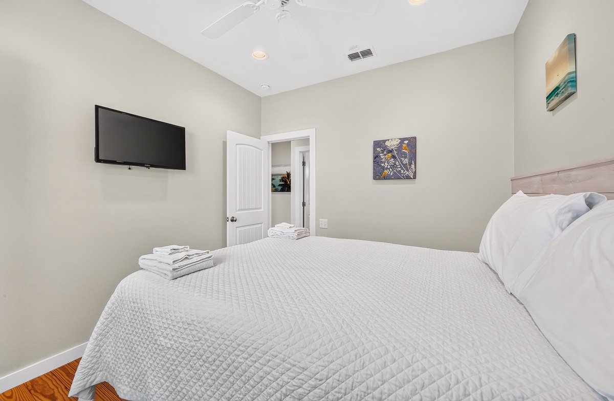 Unwind in this serene bedroom where soft linens and calming tones invite you to drift into restful sleep after your adventures.