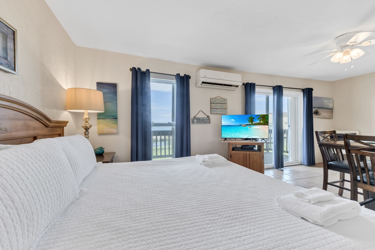 Sink into comfortable beds while enjoying tropical views on your flat-screen TV. Cool ocean breezes flow through sliding doors to your private balcony.