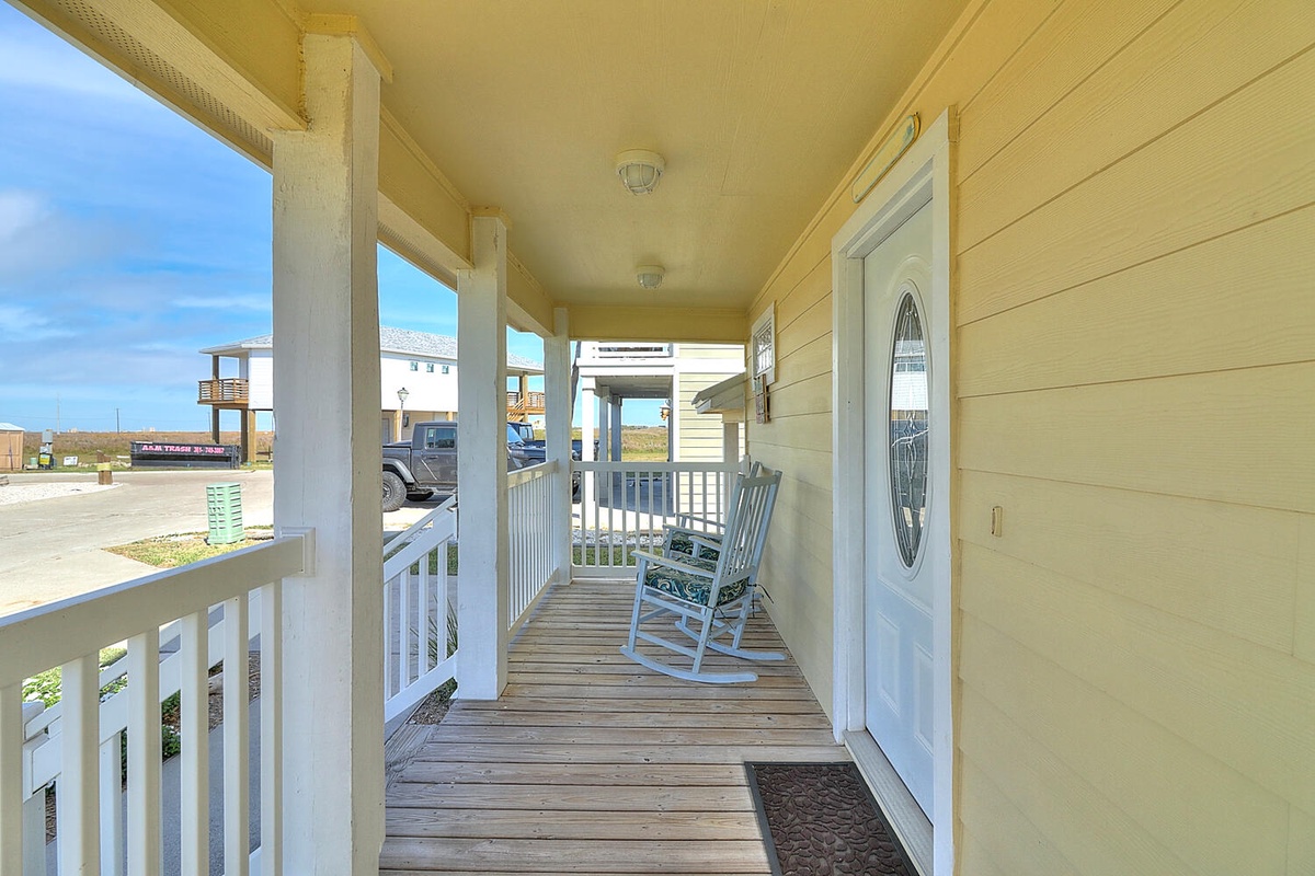 Step onto your charming covered porch and settle into the rocking chair for peaceful moments with coastal breezes.