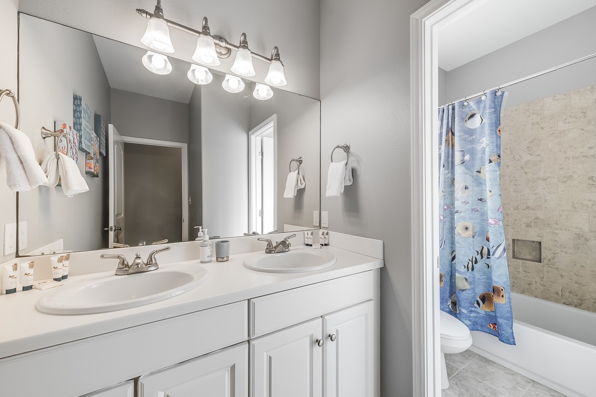 Refresh in your spacious dual-sink bathroom with bright vanity lighting and a relaxing tub/shower combo.