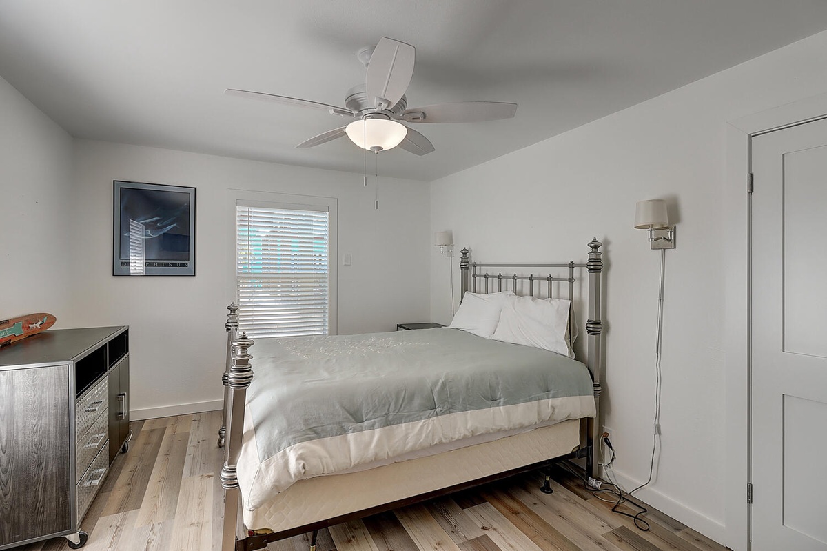 Rest peacefully in your cozy bedroom with fresh linens, ceiling fan, and warm natural light streaming through the windows.