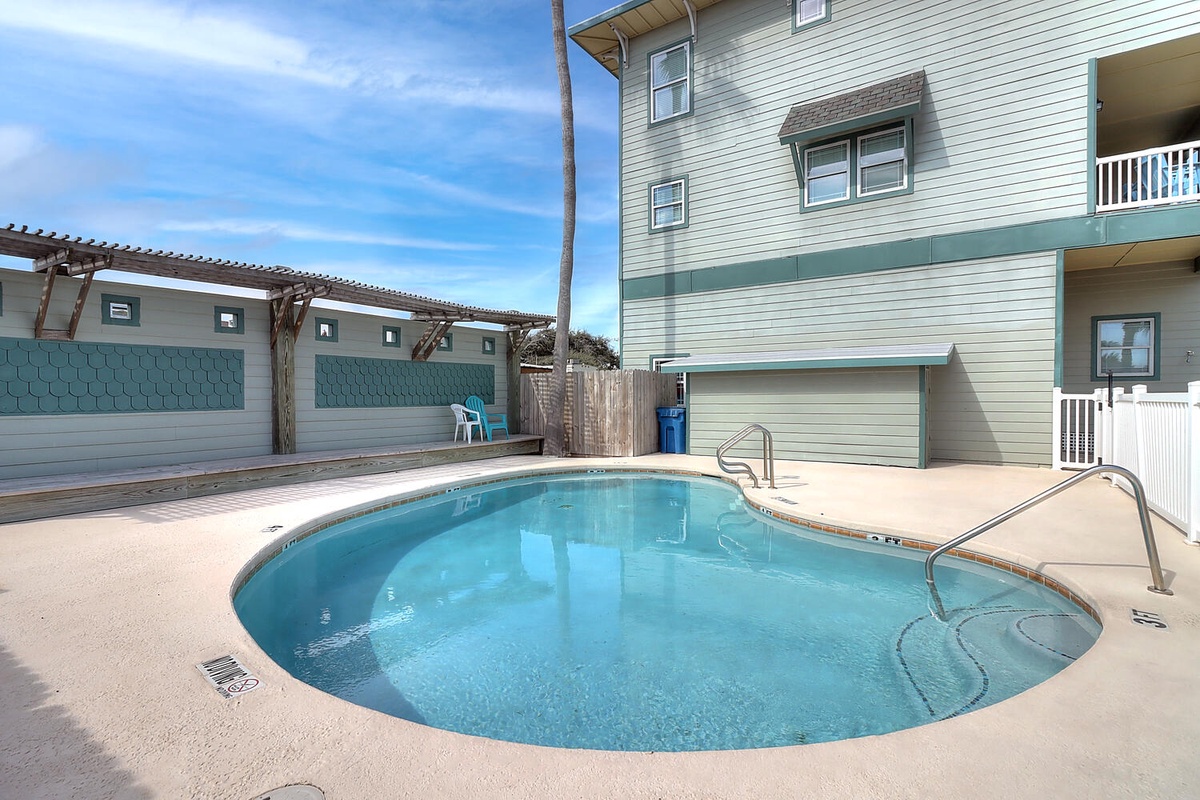 Dive into your private oasis! This sparkling pool offers the perfect escape for cooling off after beach days or simply lounging poolside.