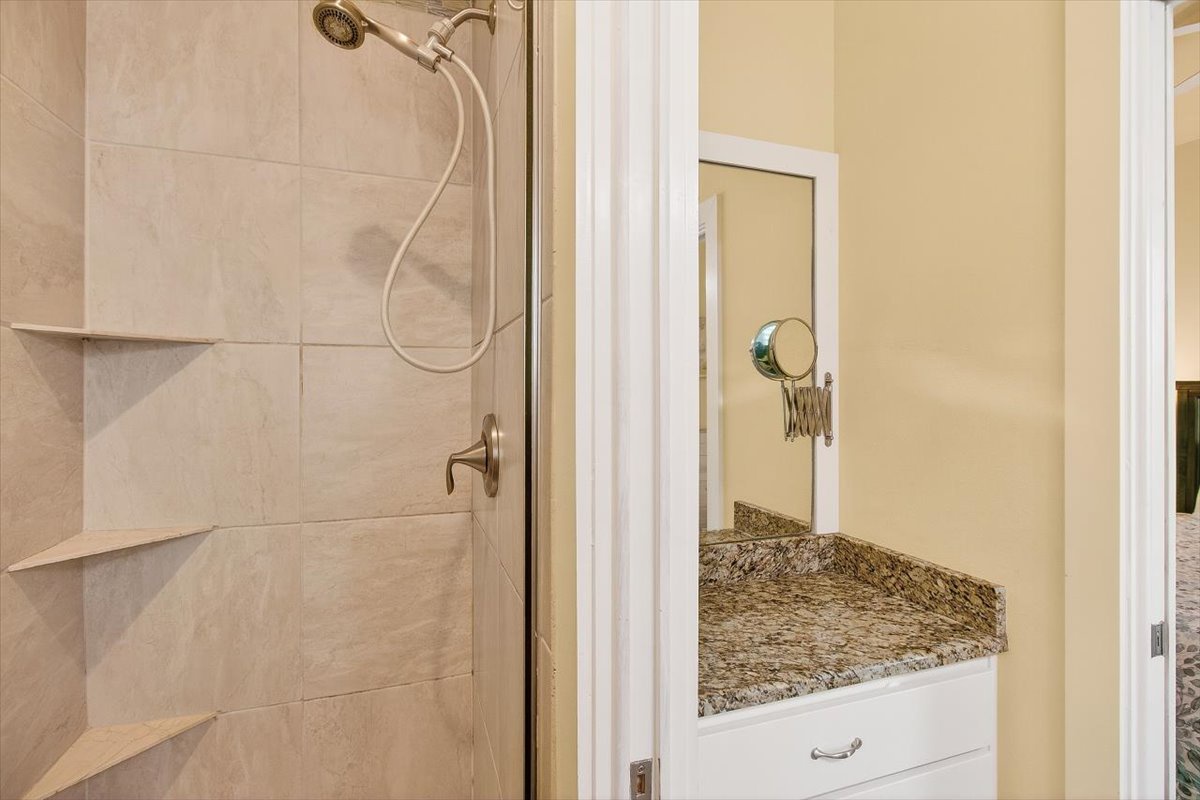 Your private bathroom features a spacious shower and granite vanity, perfect for refreshing after your adventures.