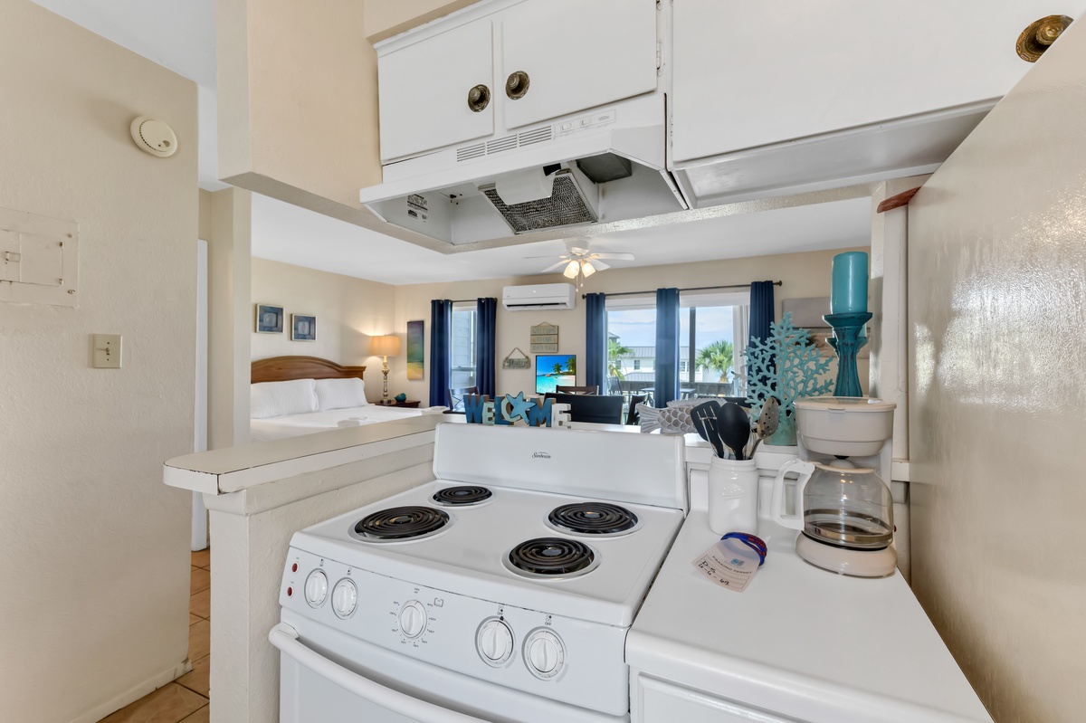 Cook your favorite meals in this fully equipped kitchen with ocean views streaming through your windows.