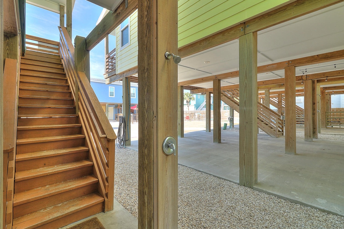Ground level entrance with covered parking and beach storage beneath your elevated coastal retreat.