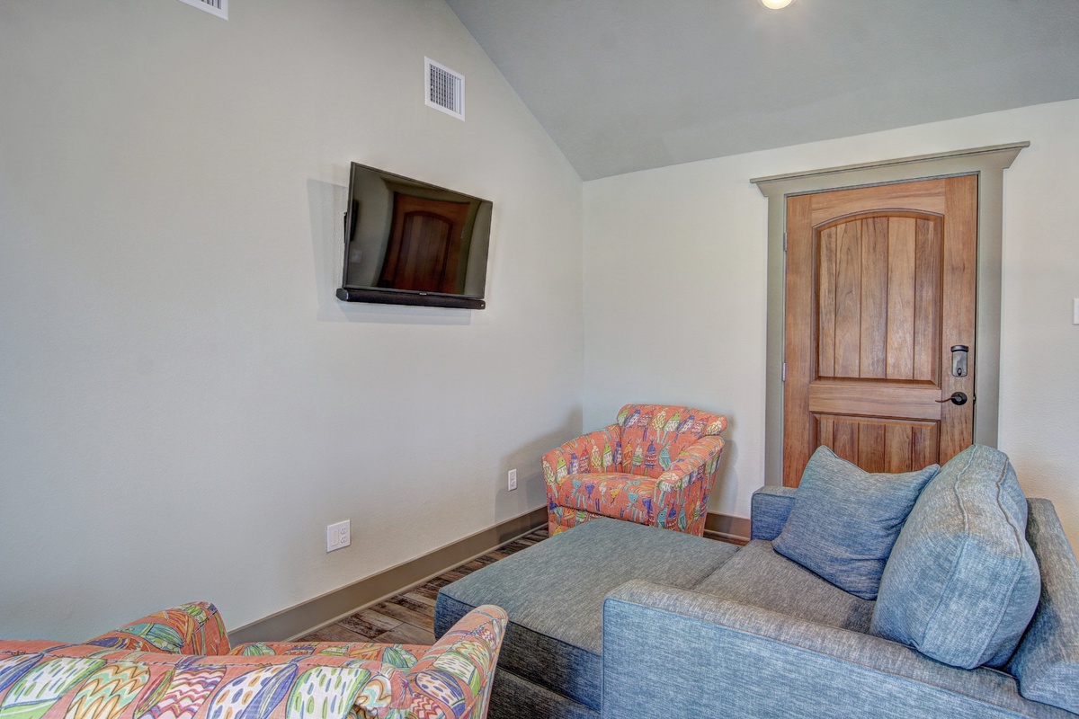 Relax in your cozy living space with comfortable seating and entertainment for peaceful evenings in.