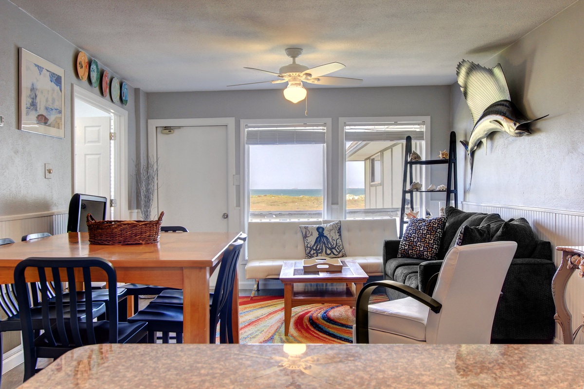 Relax in your coastal retreat where ocean views frame the comfortable living space, perfect for unwinding after beach adventures.