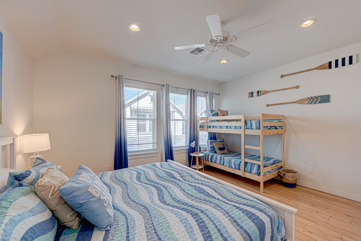 Unwind in your coastal-inspired bedroom where nautical blues and whites create a peaceful retreat for the whole family.