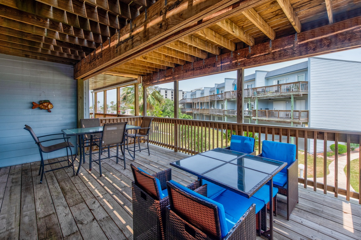 Relax on your spacious covered deck with comfortable seating and dining areas, perfect for morning coffee or evening cocktails.