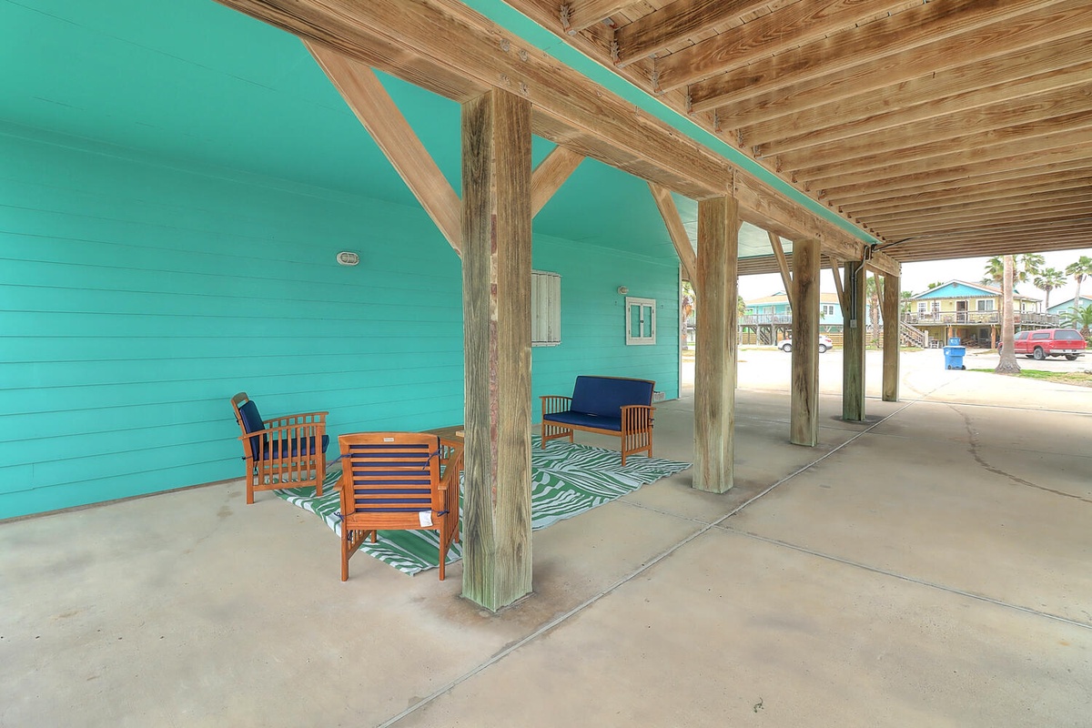 Relax in your private covered patio with comfortable seating and tropical-inspired decor, perfect for morning coffee or evening conversations.