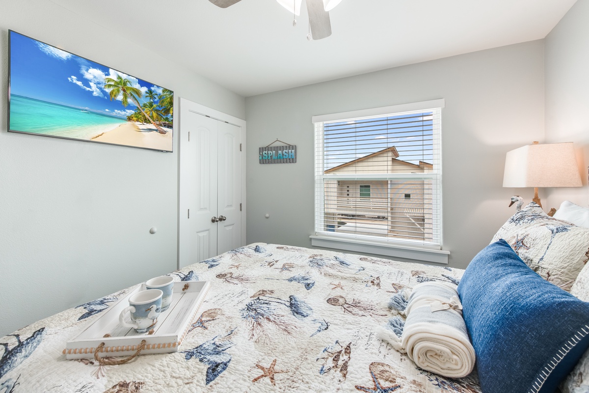 Relax in your coastal-themed bedroom with beach views on the wall-mounted TV and soft linens waiting for your arrival.
