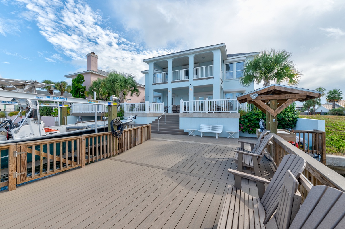 Stunning waterfront home with classic coastal architecture, dual porches, and private dock. Direct water access for boating enthusiasts and unforgettable views.