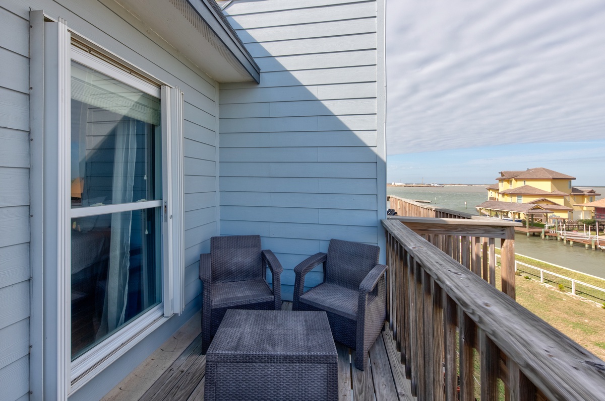 Step onto your private balcony and sink into comfortable wicker seating, where you'll enjoy peaceful moments overlooking the coastal surroundings.