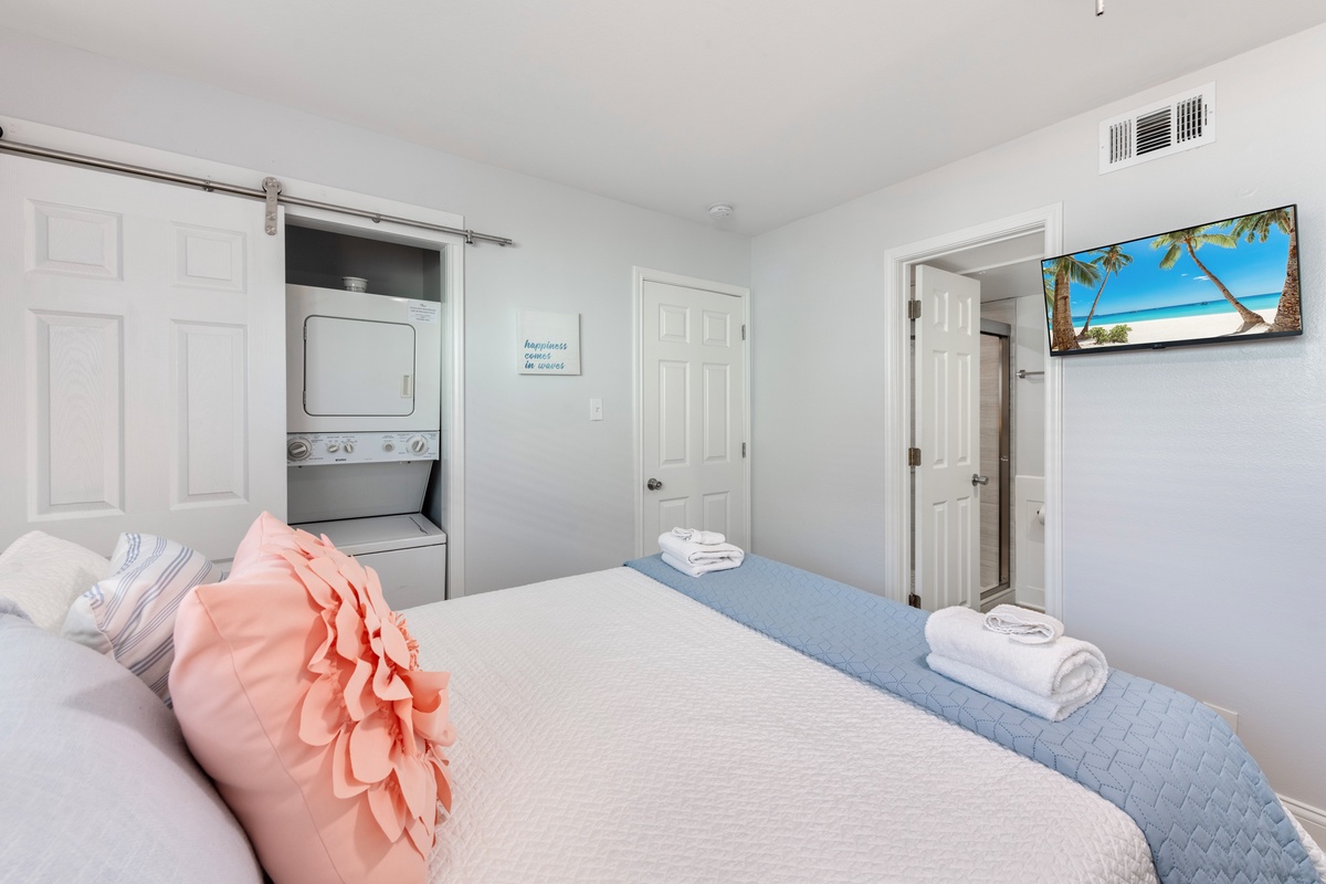 Sink into your cozy retreat with fresh linens, in-room laundry convenience, and tropical scenes to inspire your getaway dreams.