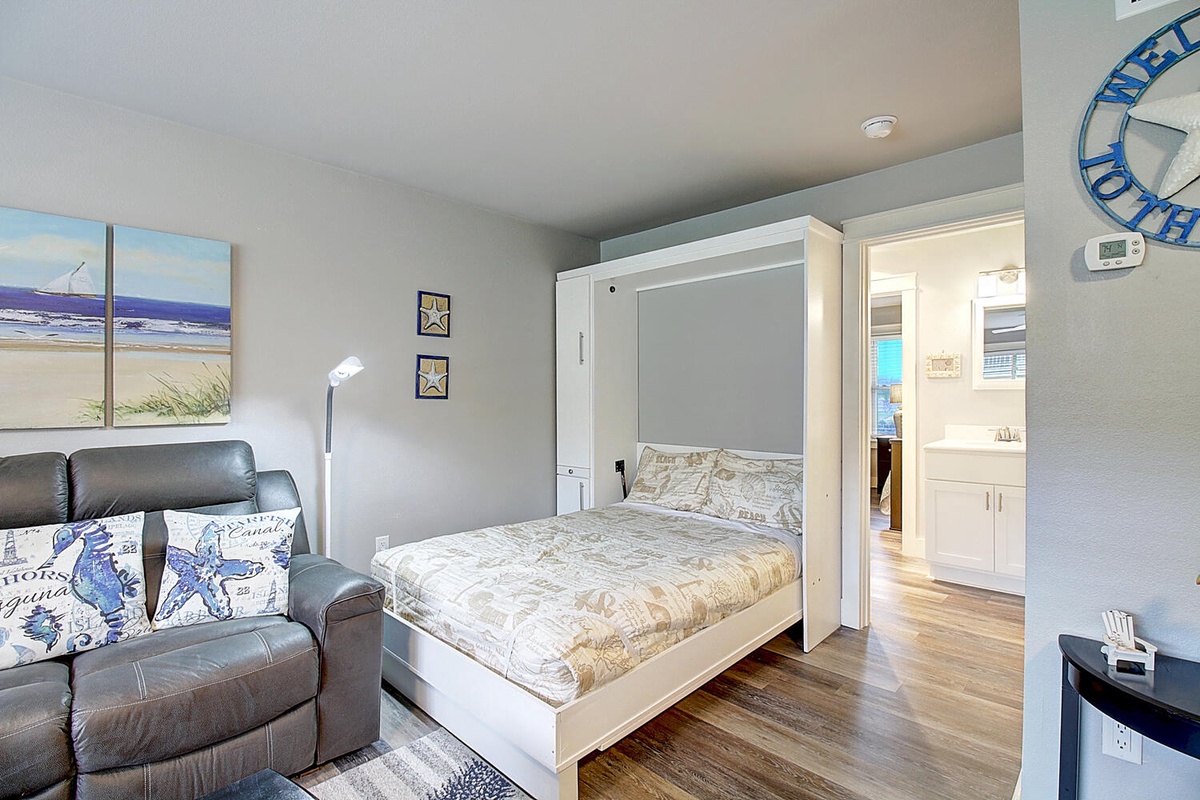 Your space-saving Murphy bed effortlessly transforms this living room into a comfortable bedroom when you're ready to rest.