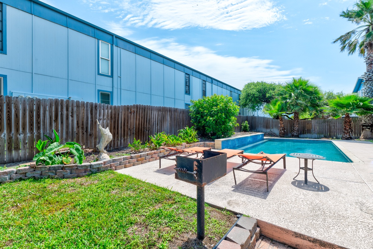 Soak up the sun in your private backyard oasis with sparkling pool, BBQ area, and tropical landscaping.