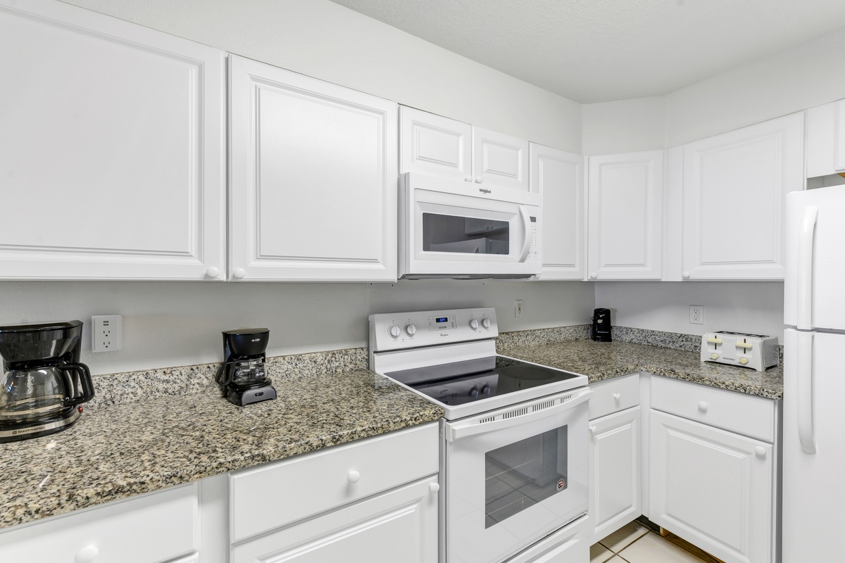 Your fully equipped kitchen features granite countertops, modern appliances, and everything you need to create memorable meals during your stay.