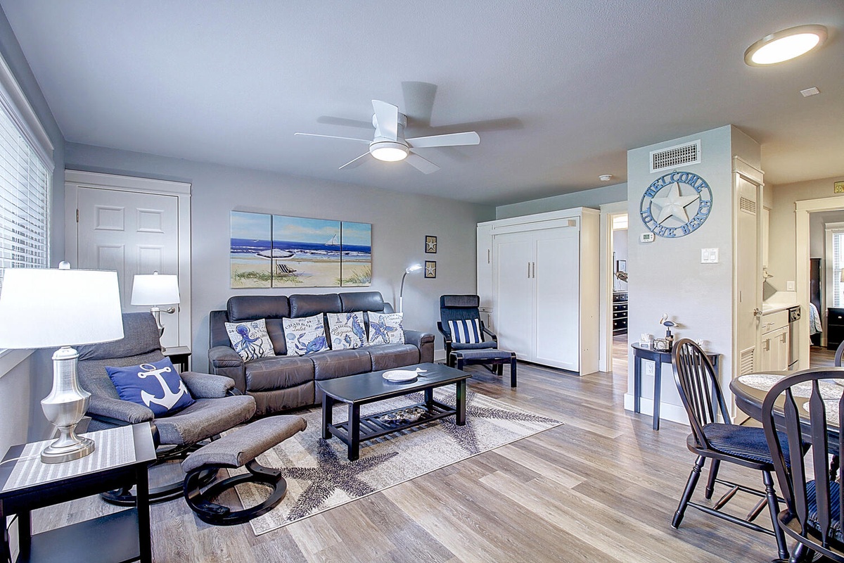 Your coastal-themed living space blends comfort with beach charm, featuring soft seating and nautical touches that make every moment feel like vacation.