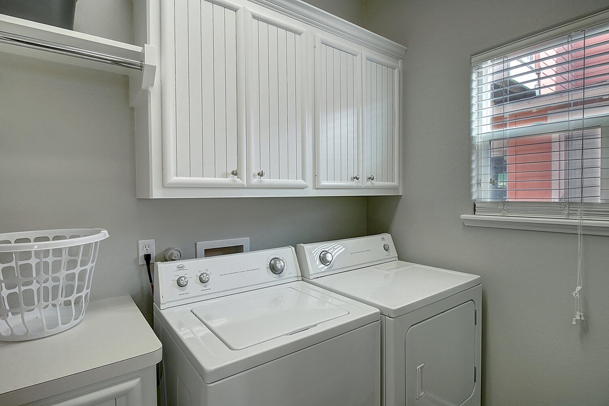 Your dedicated laundry room keeps your vacation wardrobe fresh with a full-size washer and dryer, plus ample storage space.