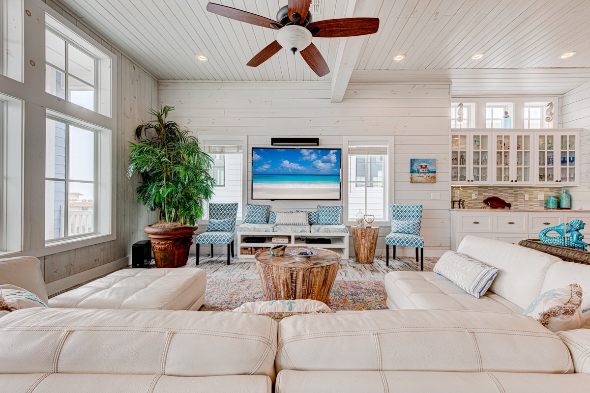 Sink into plush coastal comfort where beach vibes meet modern luxury in your spacious retreat.