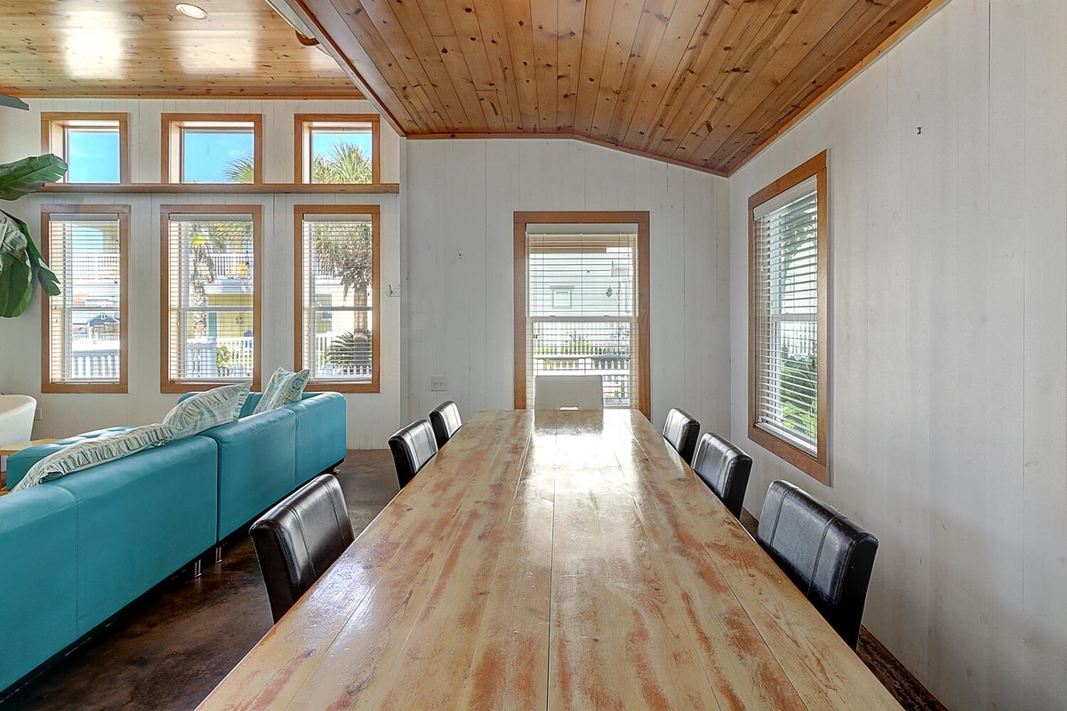 Your group gatherings come alive in this bright dining space with rustic wood ceiling and abundant natural light.
