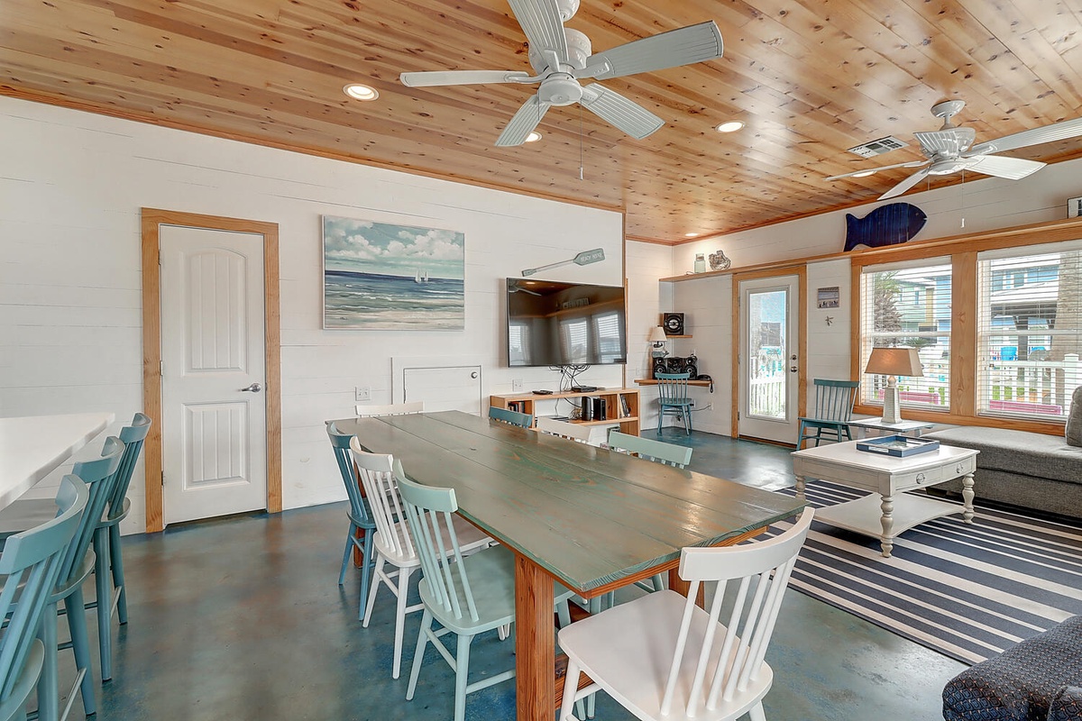Gather around this spacious dining table where your group can share meals and make memories under beautiful wood ceilings.